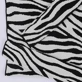 بلوفر رسومات حريمى تريكو ابيض في اسود شتوي من اتش - Zebra